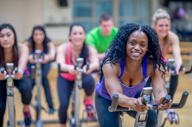 istock Group stationary bike  class 1323208940