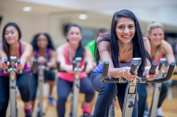 istock Group stationary bike  class 1323208942