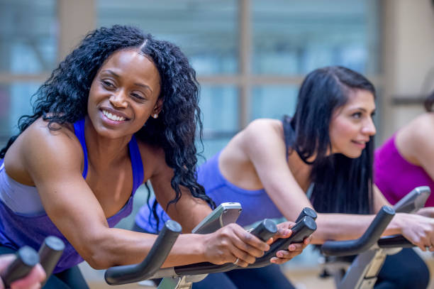 istock Group stationary bike  class 1323208946