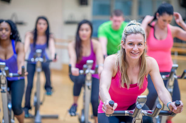 istock Group stationary bike  class 1323208952