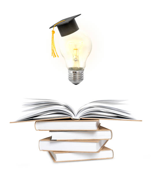 istock learning and idea concept. glowing light bulb with a graduate cap above an open book on a stack of books 1323217836