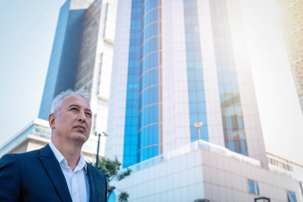 istock businessman with white hair going to his office 1323218437