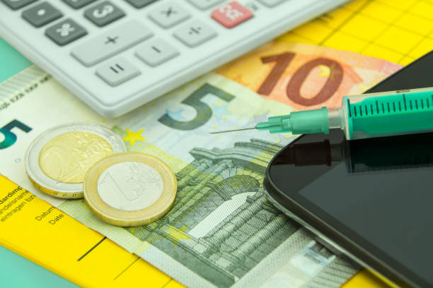 istock Vaccination certificate and mobile with calculator and Euro 1323221124