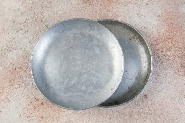 istock Old metal plates for scales on concrete background. 1323222097