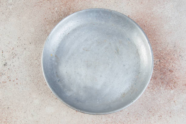 istock Old metal plate for scales on concrete background. 1323222973
