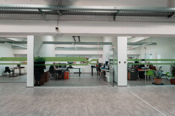 istock A modern glass office in the industry. Office with computers, tablets and modern devices. 1323223852