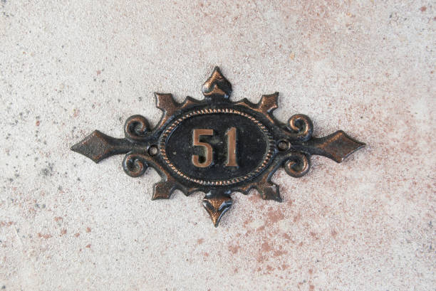 istock Old metal home number sign 1323225037