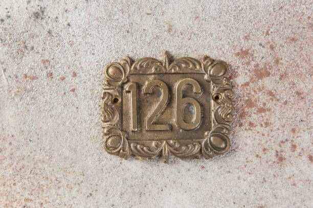 istock Old brass home number sign 1323225071