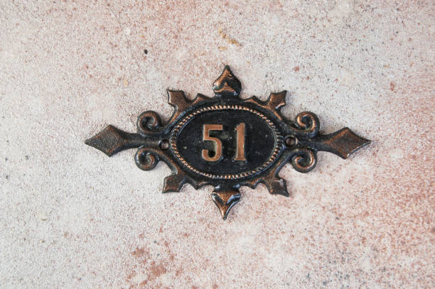 istock Old metal home number sign 1323225121