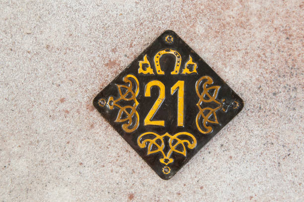 istock Old brass home number sign 1323225160