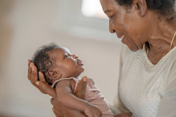 istock Quality time with newborn granddaughter 1323225207