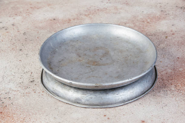 istock Old metal plates for scales on concrete background. 1323225239