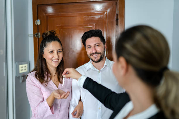 New home owners receiving the keys to a new apartment stock photo