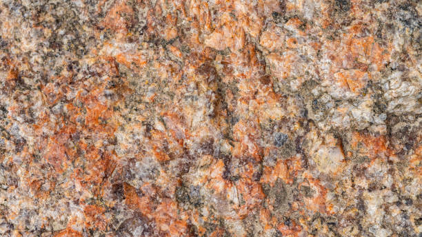 istock Background of granite. Texture of brown granite stone. Weathered stone surface. Copy space 1323227713