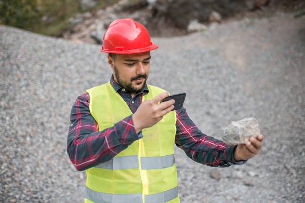 istock Engineer takes a picture of stone 1323230656