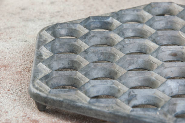 istock Old aluminum dumplings mold on concrete background. 1323230725