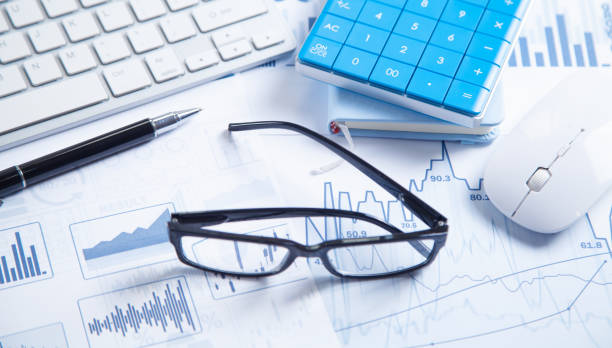 istock Business graphs, computer keyboard, pen, eyeglasses. Business. Analysis. Accounting 1323233006