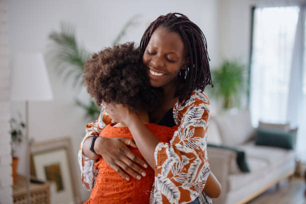 istock Mother and daughter embracing 1323233873