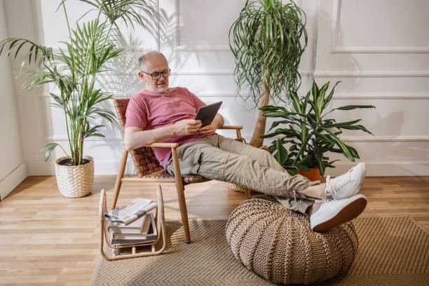 istock Senior man online shopping from his home 1323233953