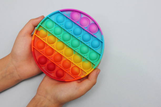 istock Popular modern anti-stress toy Pop it in children's hands. 1323234086