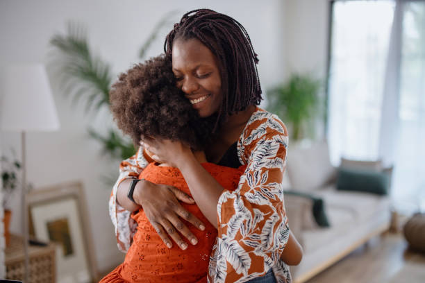 istock Mother and daughter embracing 1323234761
