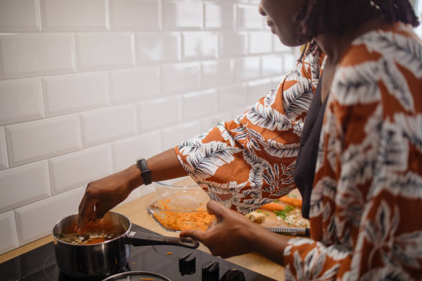 istock Mother and daughter cooking together 1323234862