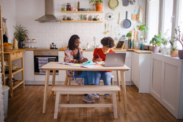 istock Mother helps her daughter with homework 1323234920