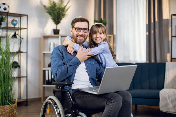 istock Daughter hugging father that sitting in wheelchair 1323236104