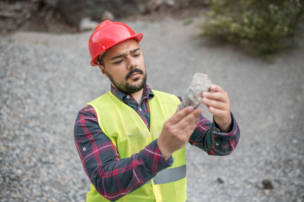 istock Worker examining the stone in detail 1323236958