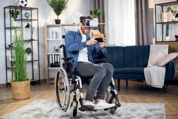 istock Handicapped man in virtual glasses playing games 1323237028