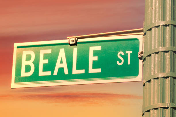 Beale Street Sign A Beale Street Sign in Memphis, Tennessee during a bright orange sunset. tennessee road sign stock pictures, royalty-free photos & images