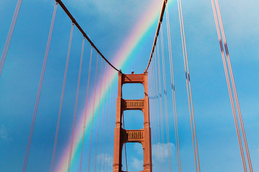 A rainbow across the Golden Gate Bridge in San Francisco California after a rain.
