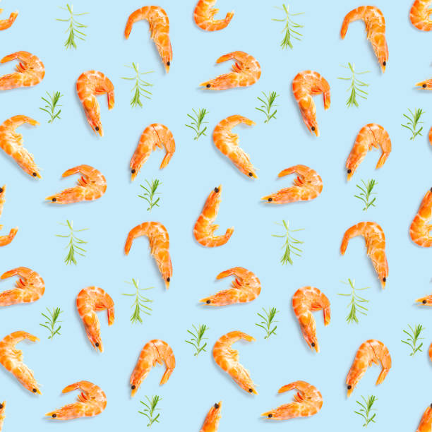 istock Tiger shrimp. Seamless pattern made from Prawn isolated on a blue background. Seafood seamless pattern with shrimps. seafood pattern 1323239614