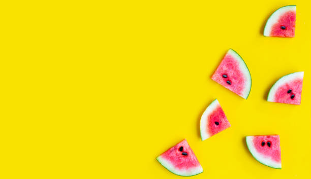 istock Slices of watermelon on yellow background. 1323241327