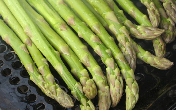 istock Fresh From Garden Organic Asparagus Cooking on Grill 1323244773