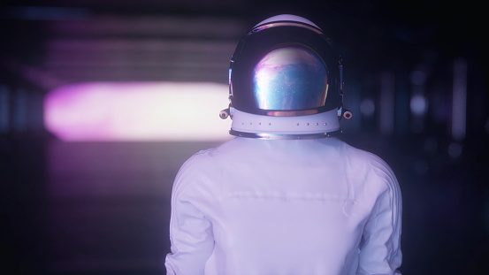 Portrait of the futuristic astronaut on the spaceship looking around in wonder. Space travel, exploration and solar system colonization concept. 3d rendering.