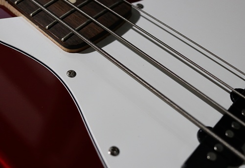 A Bass guitar neck pickups bridge volume pots selective focus
