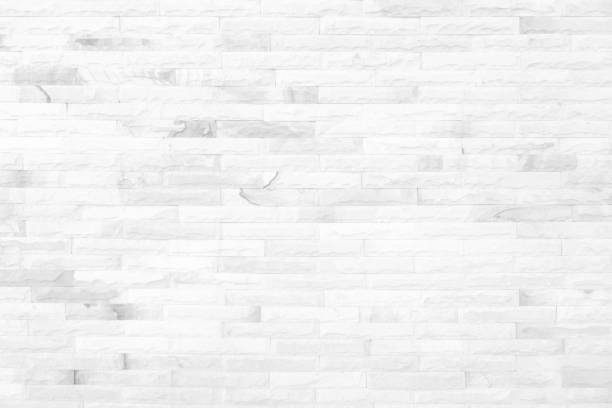 istock White grunge brick wall texture background for stone tile block painted in grey light color wallpaper modern interior and exterior and room backdrop design 1323251744
