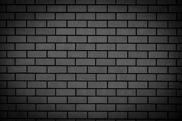 istock Black brick wall. Abstract background for design. Backdrop for product display. 1323254121