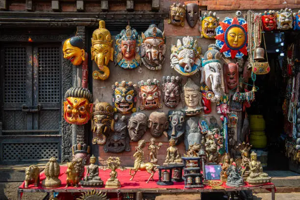 Photo of Wooden masks and handicrafts on sale at local shop in the Thamel market, Thamel District of Kathmandu, Nepal.