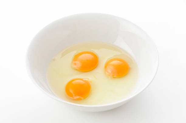 istock yellow egg yolks in a white bowl 1323261367