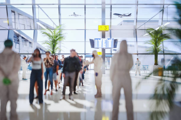 Airport security checkpoint with people standing in line Airport security checkpoint with people standing in line. 3D generated image. Airport is custom modeled and not based on any real location. security barrier photos stock pictures, royalty-free photos & images