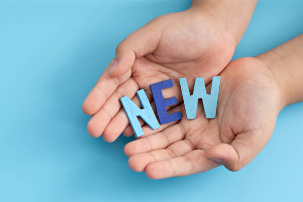 istock Palm oh hand showing NEW message 1323264681