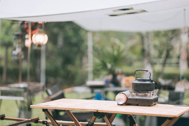 istock camping stove hot kettle boiling on picnic table in the morning 1323264727
