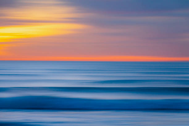 istock Smooth ocean motion seascape pan with deep blue and golden hues 1323264833
