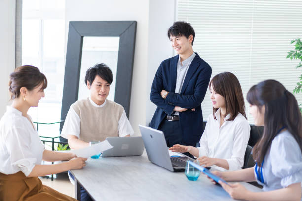istock Young businesspersons working in an office 1323270756