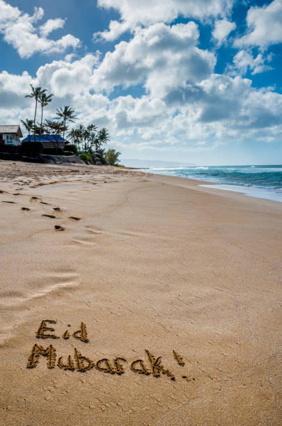 istock Eid Mubarak written in the sand 1323274528