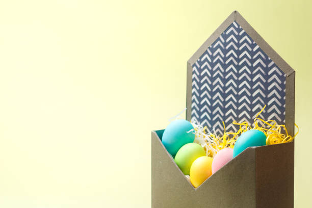 istock Happy Easter card with easter eggs in cream colors. Minimal easter concept with copy space for web banner. 1323277419