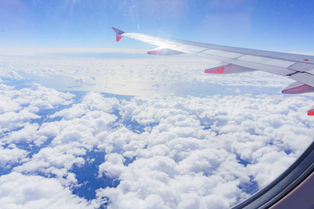 istock View from a jet plane window high on the blue skies 1323277521
