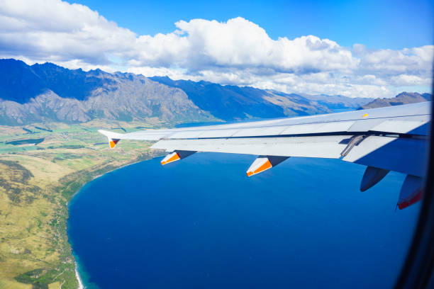 istock View from a jet plane window high on the blue skies 1323277533
